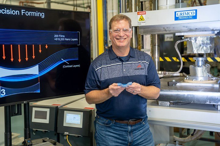 PeakNano’s Mike Hus, sr. v.p. of engineering, holds a nanolayer lens after it is formed but before the finishing step.